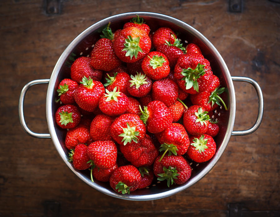 Colander full of ripe strawberries Photograph by Deborah Pendell
