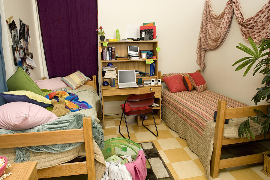 College dorm room of neat and messy roommates Photograph by Yellow Dog Productions