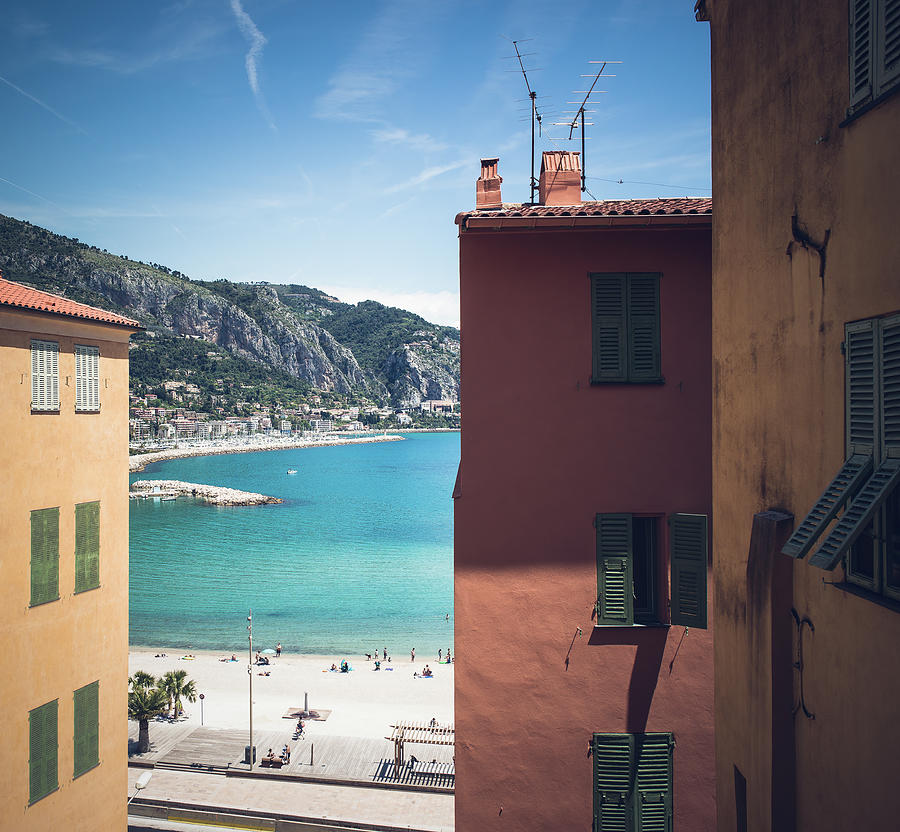 Color contrast in Menton on the French Riviera. Blue sea, orange Photograph by Jean-Luc Farges