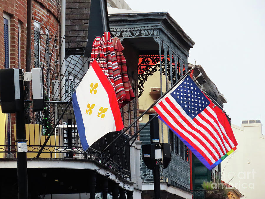 Color Flags flying in the French Quarter of New Orleans Photograph by Steven Spak