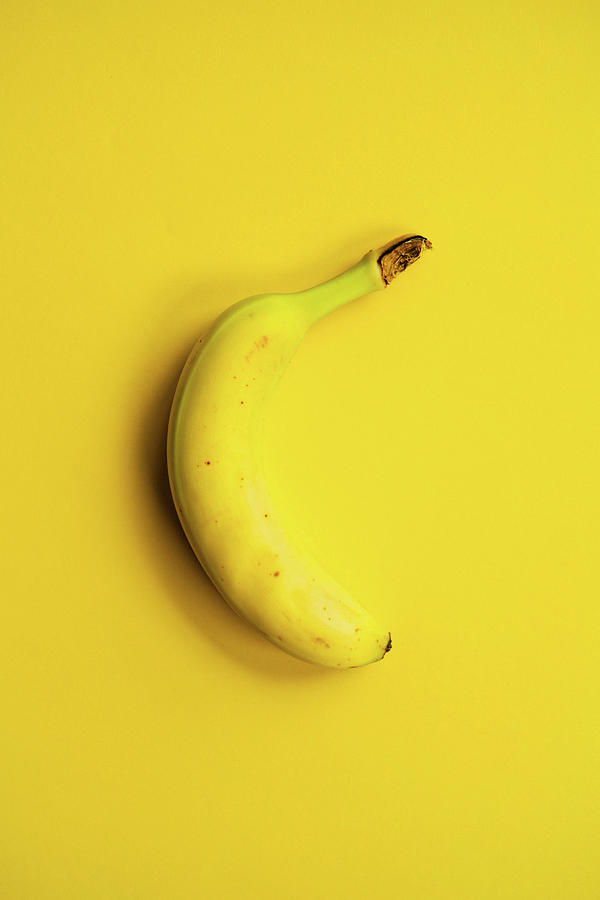 Colorblock Foods no 24 - Banana on Yellow Photograph by Beautify My Walls
