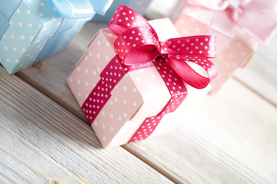 Colored gift boxes on wooden planks Photograph by Tedestudio