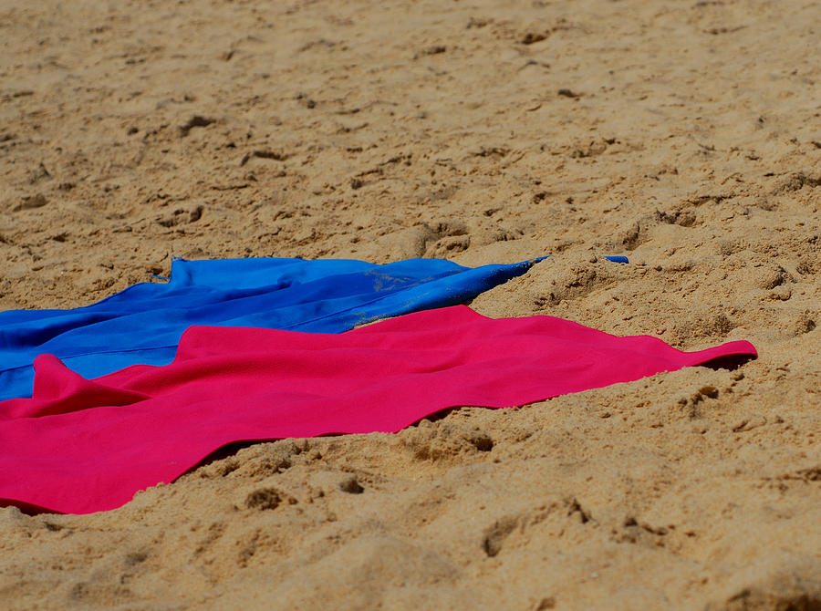 Colored towels on sandy beach Photograph by Lyn Holly Coorg