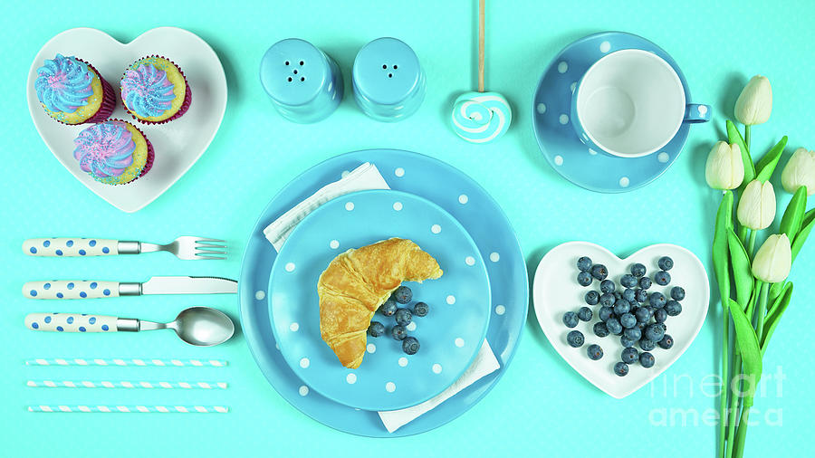 Colorful blue theme breakfast brunch table setting flatlay. Photograph by Milleflore Images