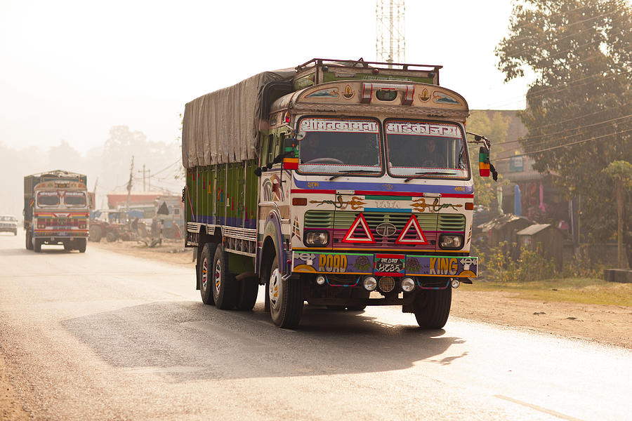 Colorful cargo truck on dusty road Photograph by Merten Snijders