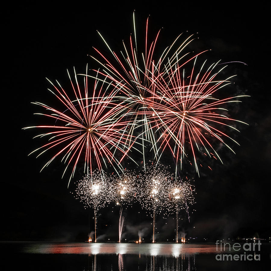 Independence Day Photograph - Colorful fireworks on river with water reflections by Gregory DUBUS