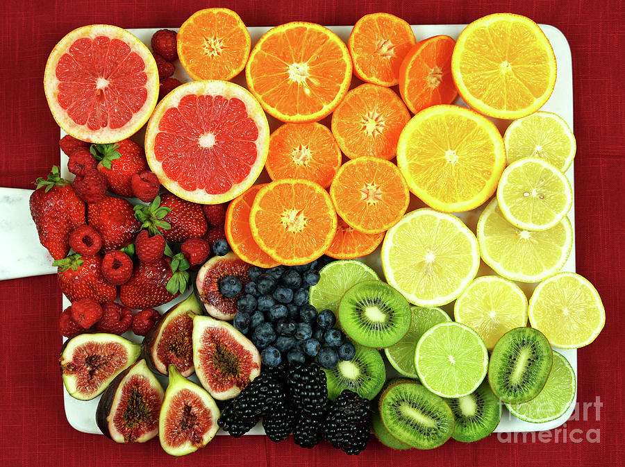Lemon Photograph - Colorful fruit platter assembly with rainbow color fruit pieces  by Milleflore Images