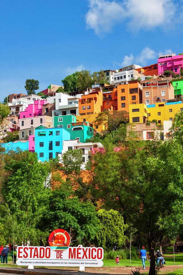 Colorful hilltop buildings and sign in Guanajuato, Mexico Photograph by Tatiana Travelways