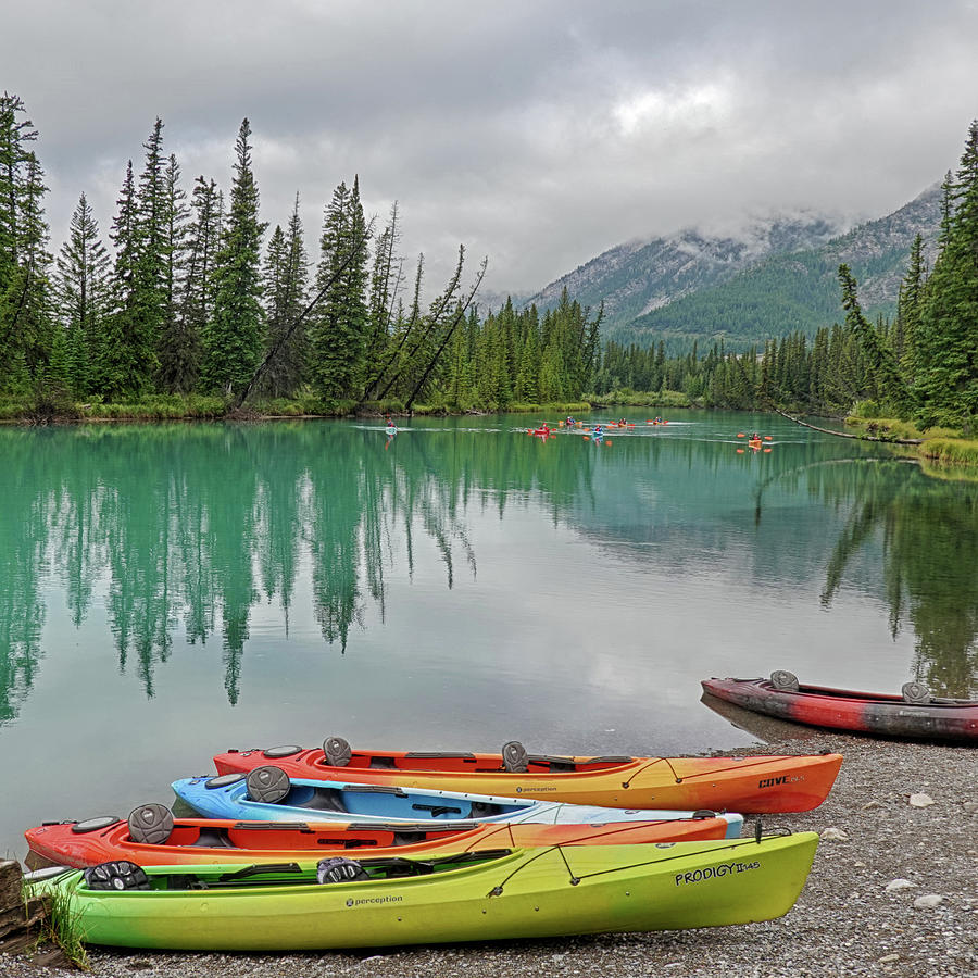 Colorful Kayaks on Bow River in Banff British Columbia BC Square Photograph by Toby McGuire