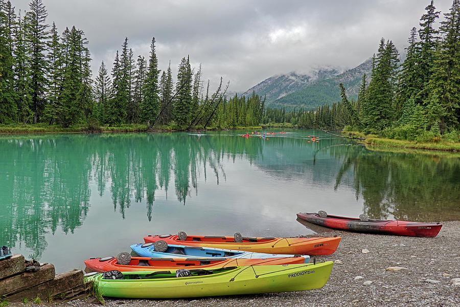 Colorful Kayaks on Bow River in Banff British Columbia BC Photograph by Toby McGuire