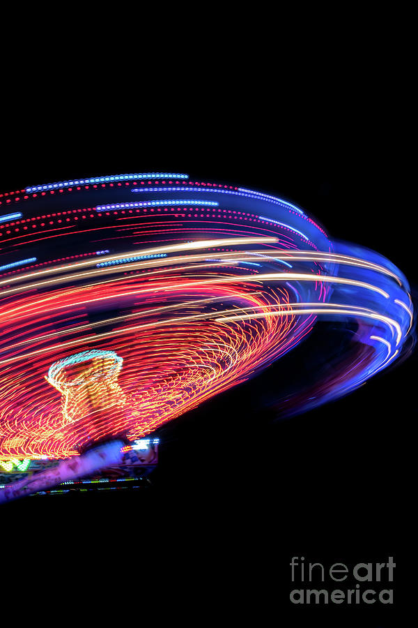 Colorful Light Trail From A Fast Carrousel At A Fun Park In The Night Photograph by Andreas Berthold