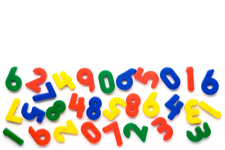 Colorful magnetic numbers on white background Photograph by Zocha_K