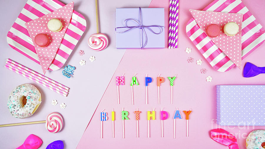 Colorful pink theme birthday party flat lay. Photograph by Milleflore Images