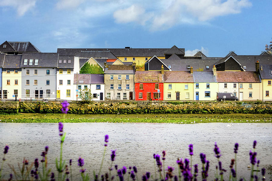 Colorful row of houses across Galway Bay in Ireland. Photograph by ...