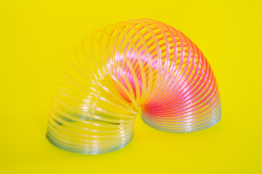 Colorful slinky toy Photograph by Valeria Vacca
