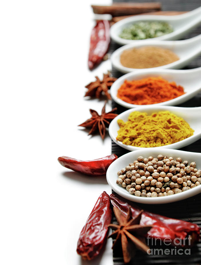 Colorful spices in spoon on white background Photograph by Jelena Jovanovic