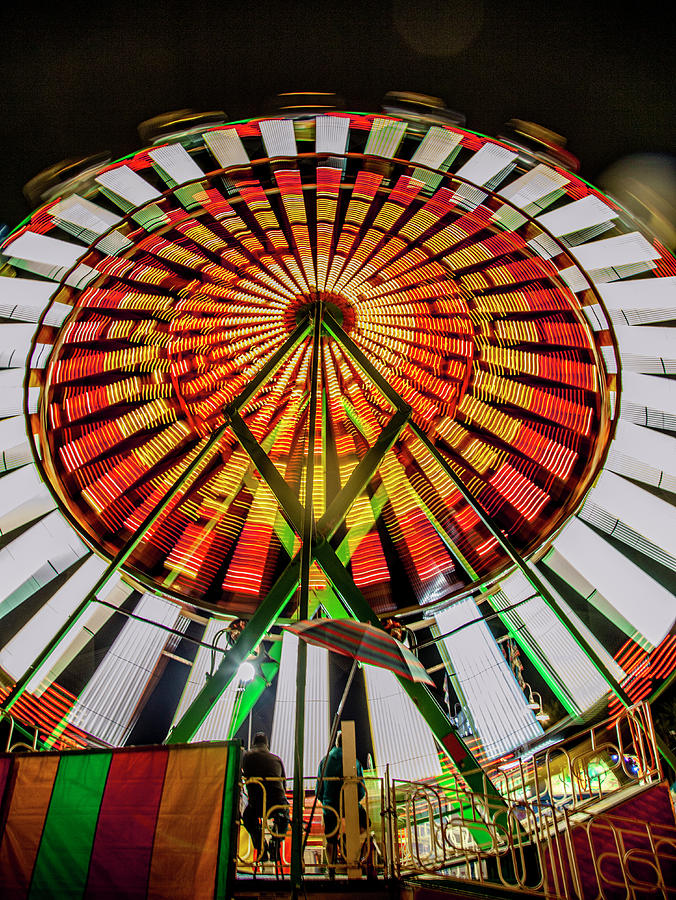 Colorful Spinning Ferris Wheel Bright Orange Slow Shutter Speed Effect Photograph by Matthew Bamberg