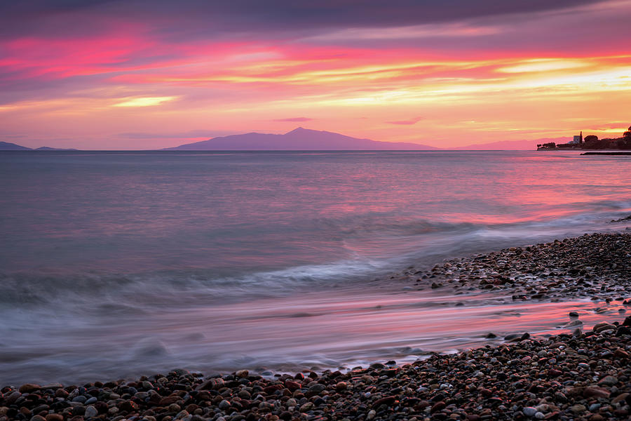 Colorful Sunset over Rocky Beach with Dramatic Clouds Photograph by Alexios Ntounas