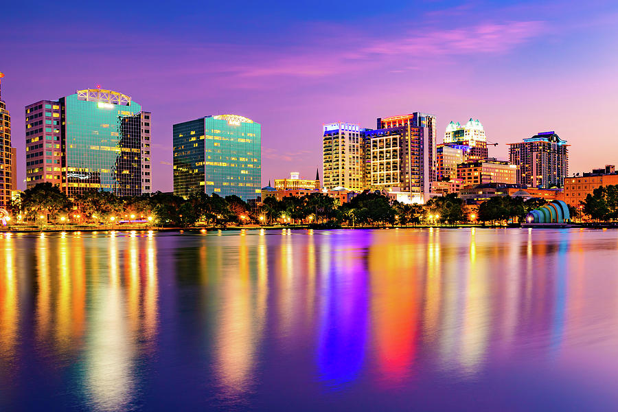Colorful Sunset Over The Orlando Skyline and Lake Eola Park Photograph by Gregory Ballos