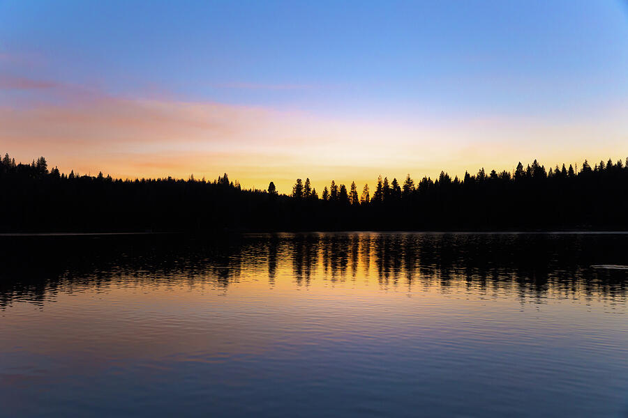 Colorful sunset sky with reflection of forest at Sequoia lake ...