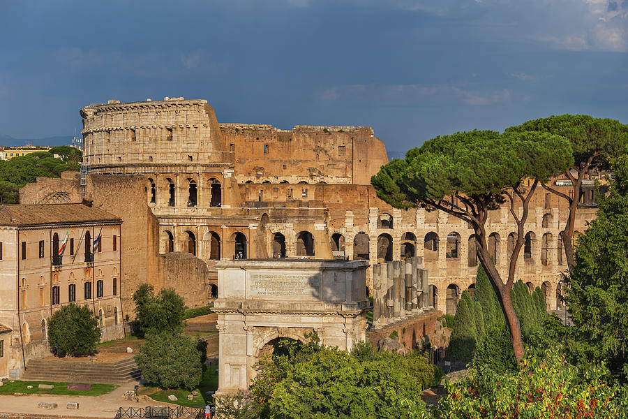 Colosseum and Arch of Titus in Rome Photograph by Artur Bogacki