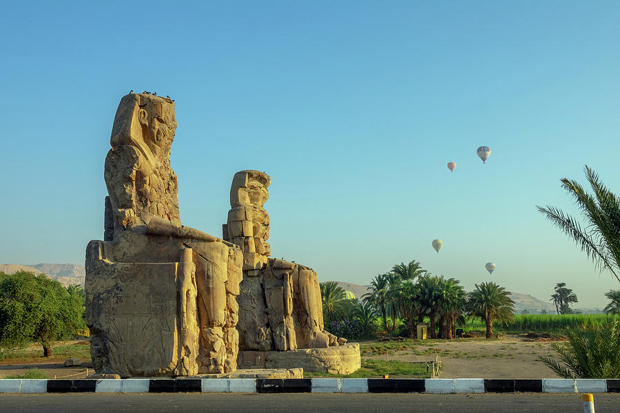 Colossi of Memnon statues and balloons Photograph by Mikhail Kokhanchikov