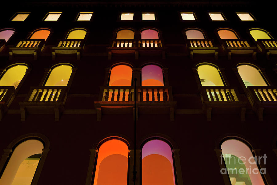 Coloured lights in the windows of the Benetton building in Venice, Italy Photograph by Neale And Judith Clark