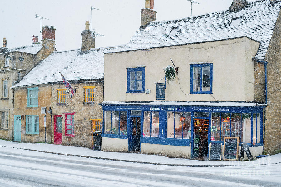 Colourful Burford Shops in the December Snow Photograph by Tim Gainey