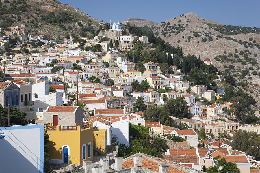 Colourful houses on hillside, Horio, Symi, Greece Photograph by David C Tomlinson