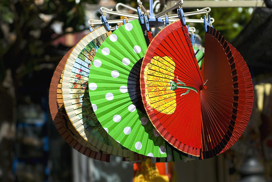 Colourful Spanish fans for sale in marketplace Photograph by Lyn Holly Coorg