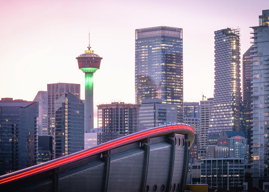 Colourful sunset over Calgary Photograph by Peter Kolejak