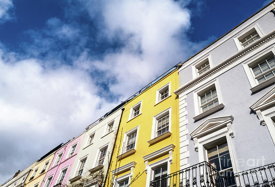 Colourful terraced townhouses with summer sky background and spa Photograph by Jane Rix