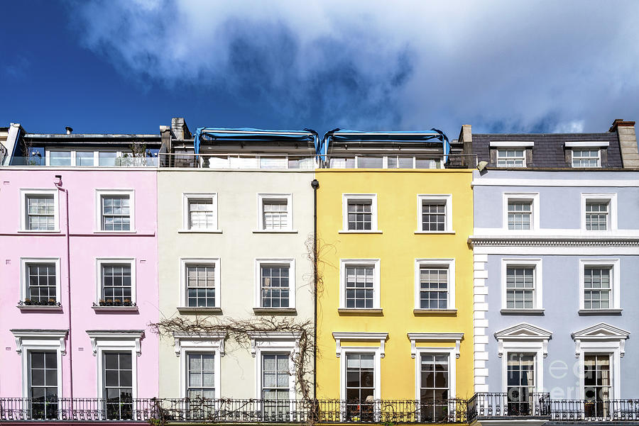 Colourful terraced townhouses with summer sky background. The ar Photograph by Jane Rix