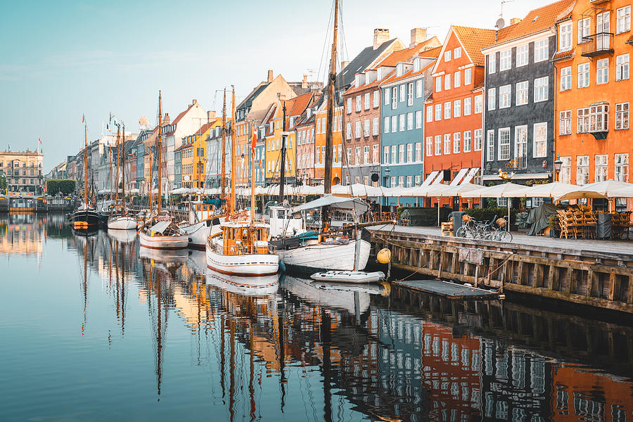 Colourful townhouses facades and old ships along the Nyhavn Canal, Copenhagen Photograph by © Marco Bottigelli