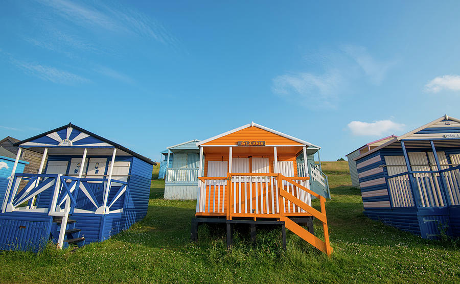 Colourful wooden beach huts Photograph by Michalakis Ppalis