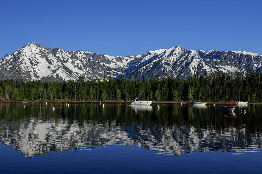 Colter Bay Boats And Mountains Reflection Photograph by Dan Sproul