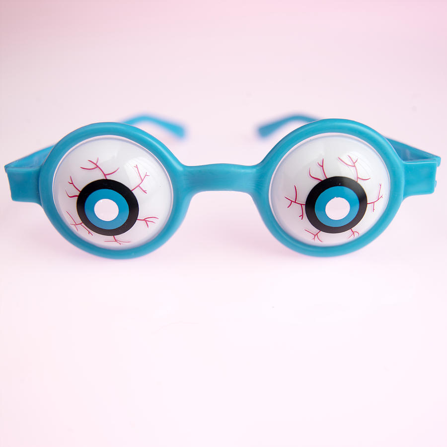Comedy glasses, close up Photograph by Paul Tearle