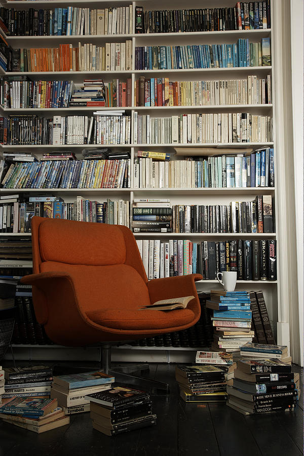 Comfortable Chair Surrounded By Books Photograph by Martin Poole