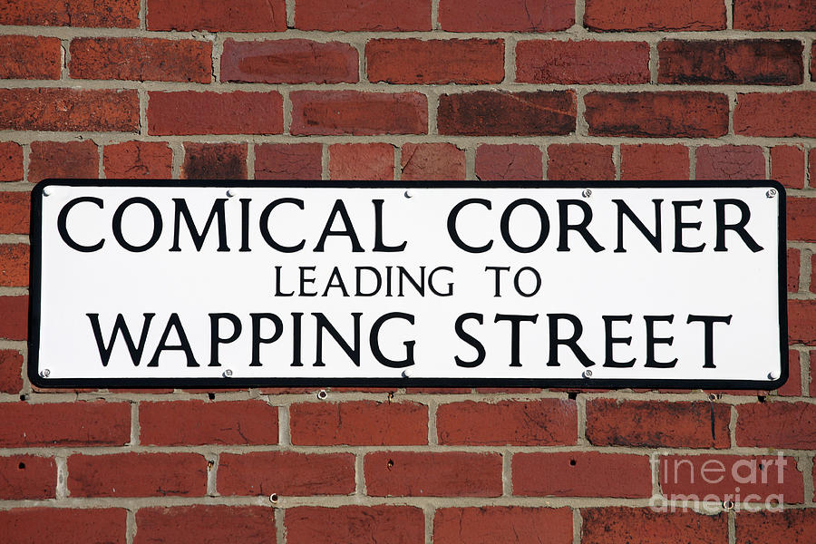 Comical Corner Street Sign Photograph by Bryan Attewell