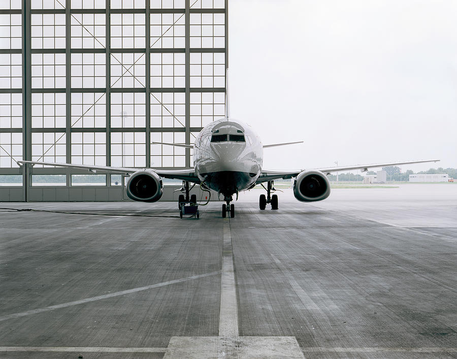 Commercial aircraft in hangar Photograph by Johannes Mann