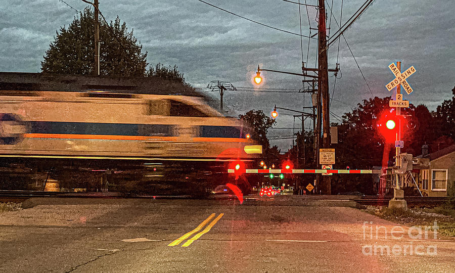 Commuter Train at Grade Crossing Photograph by Thomas Marchessault
