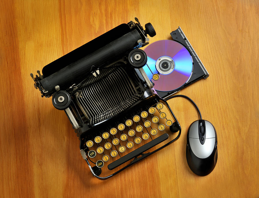 Comparison between an old typewriter and a computer Photograph by FreezeFrameStudio