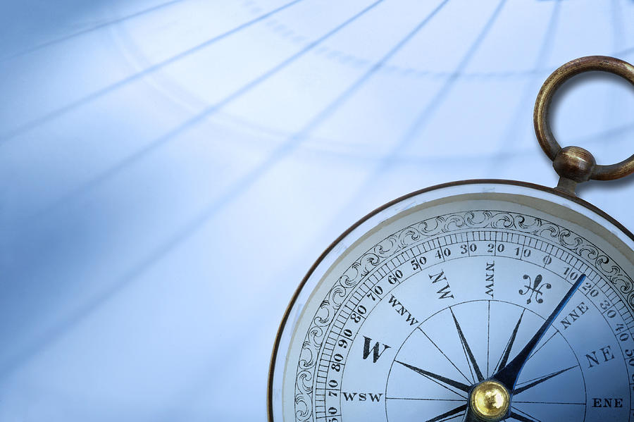 Compass on background created by latitude and longitude lines Photograph by Dny59