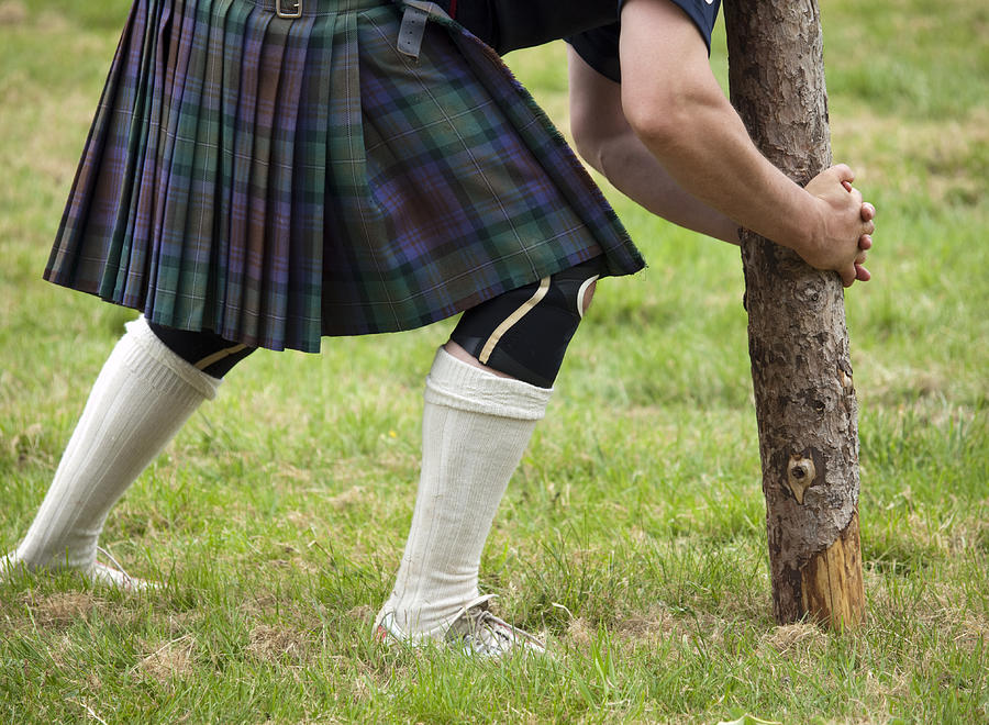 Competitor about to lift a caber Photograph by Gannet77