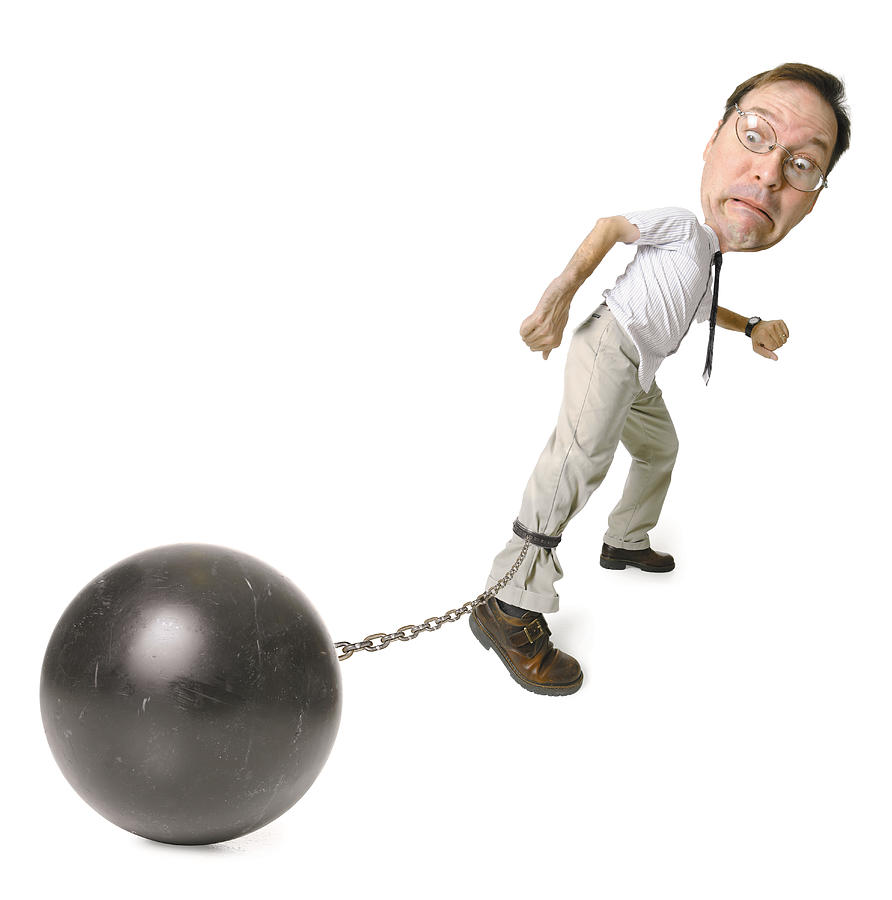 Conceptual Caricature Of A Caucasian Man In A Shirt And Tie As He Drags A Big Ball And Chain Around Photograph by Photodisc