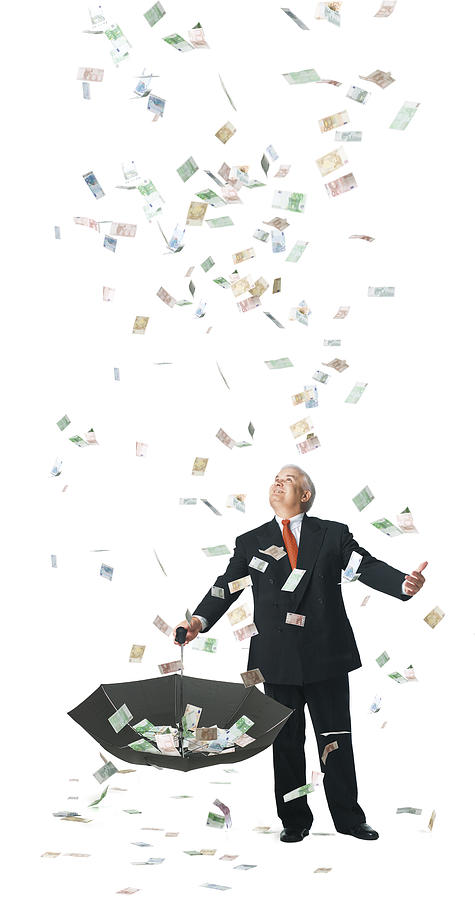 Conceptual Photograph Of A Business Man As He Catches Raining Euros In His Umbrella Photograph by Photodisc