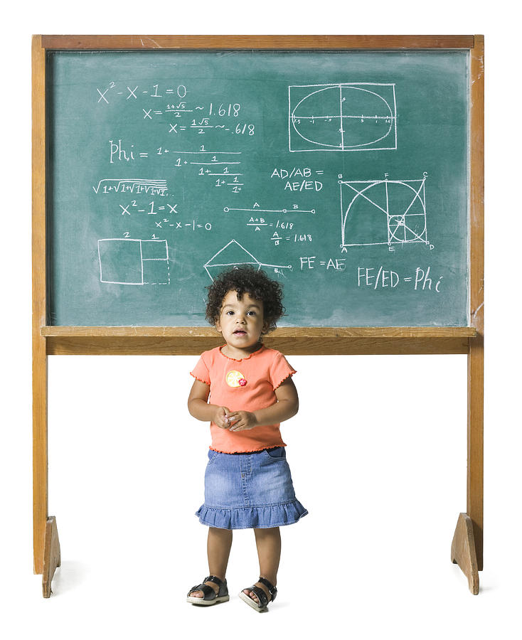 Conceptual Shot Of A Young Female Child In Front Of A Problem On A Chalkboard Photograph by Photodisc