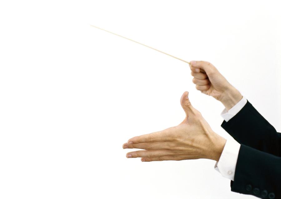 Conductors hands holding baton Photograph by Laurence Mouton