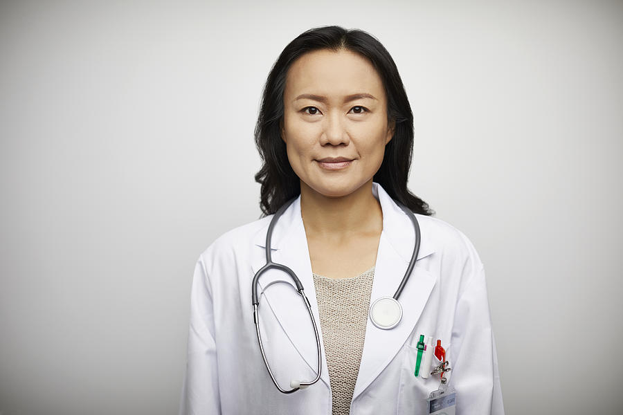 Confident portrait of female doctor in lab coat Photograph by Morsa Images Confident portrait of female doctor in lab coat Photograph by Morsa Images