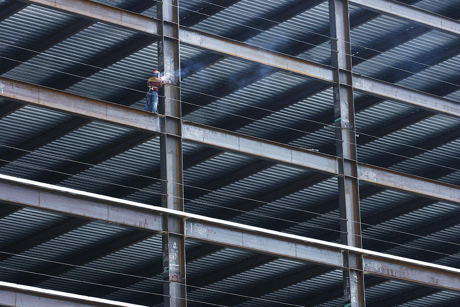 Construction Worker Welding Beam on High Rise Building Photograph by Dny59